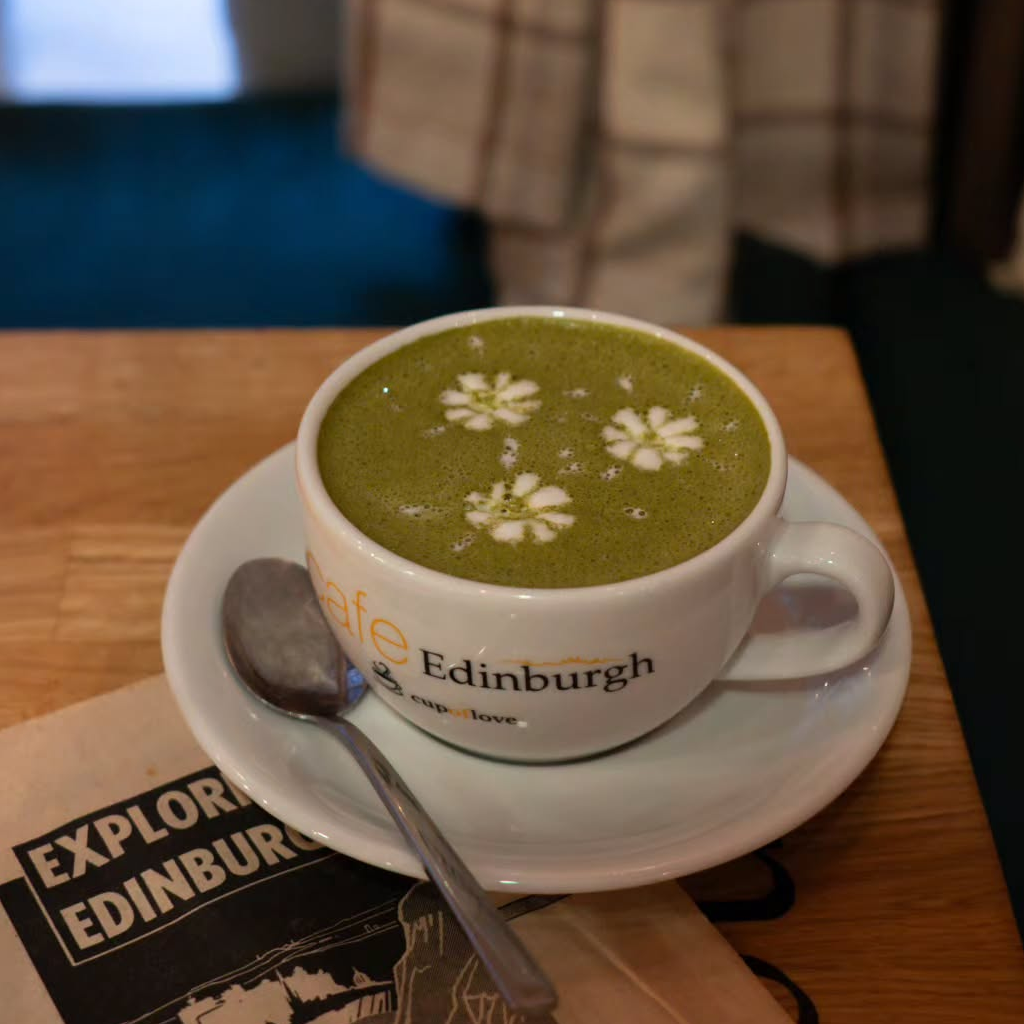 A flat white poured with rosetta latte art